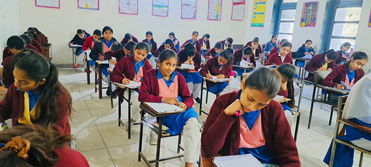 Students appearing in a PECTAA assessment in a Punjab school classroom